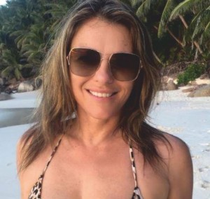 Elizabeth Hurley, at 52, sizzles in a sheer white robe - 1