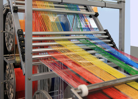 bigstock-Multi-colored-Yarns-In-The-Tex-310792042
