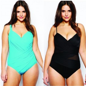 A modal in Mint and Black one piece Miraclesuit Lingerie for festival seasons